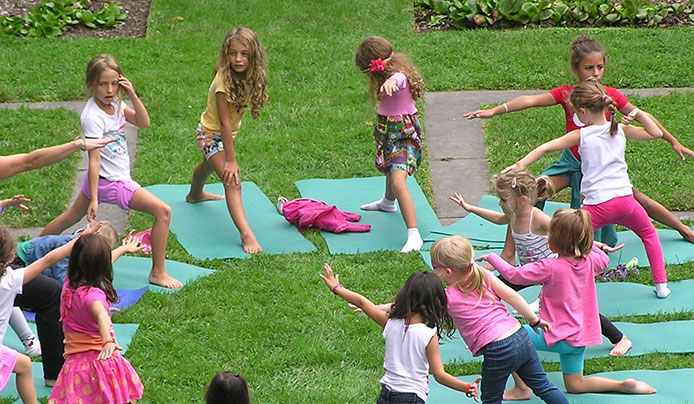 Kids and families doing yoga together