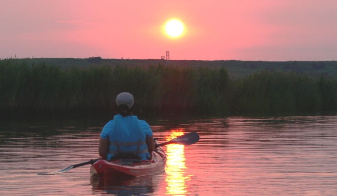 Kayaking in the meadowlands during sunset