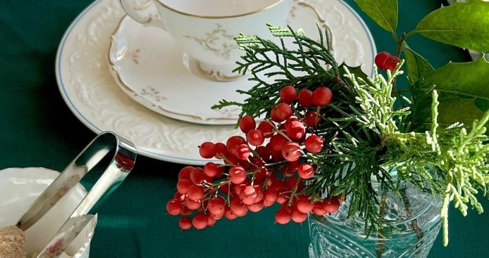 Holiday decorations near a teacup